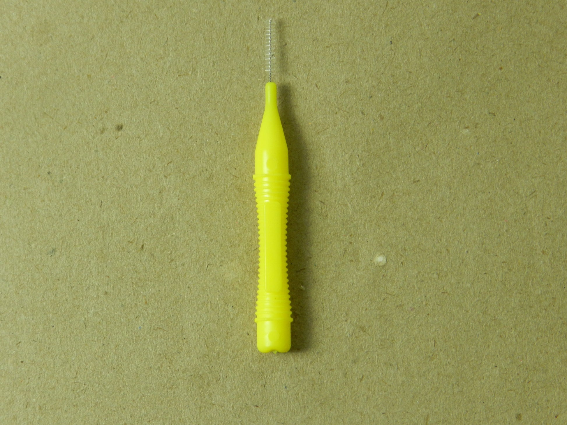 LD Ultra Interdental Brush from Dental Disposables, pack of 32, showing close-up of the small interdental brushes with blue handles.