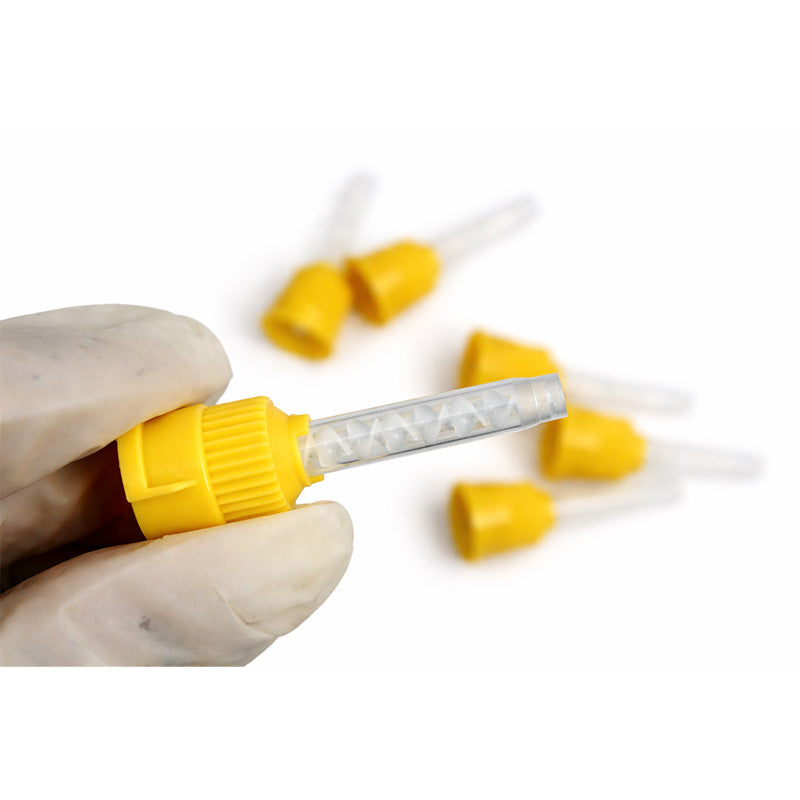 Yellow LD Mixing Tips for dispensing guns, set of 50, used in dental procedures for precise mixing and application.