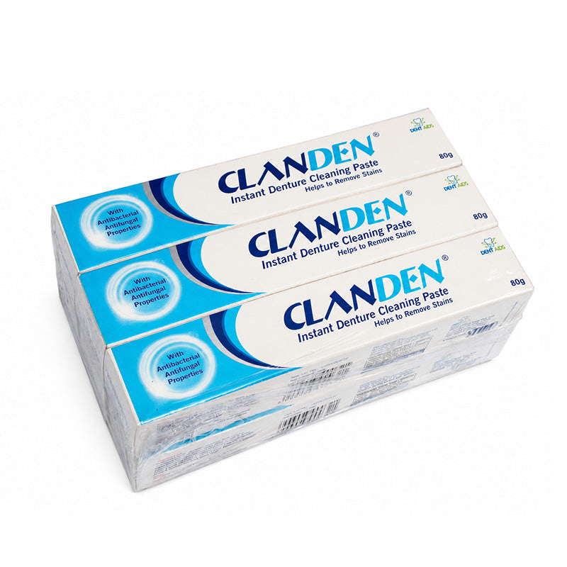 Close-up of STIM Claden instant denture cleaning paste tube, showing the denture adhesive product with branding and packaging.