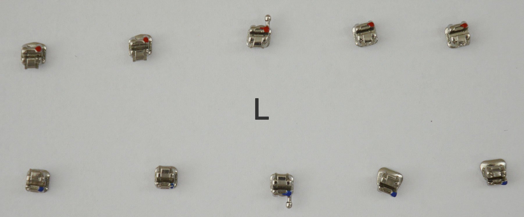 Accel Passive Self Ligating Bracket SLB MBT .022 kit with 20 orthodontic brackets for dental braces, shown in a close-up image.