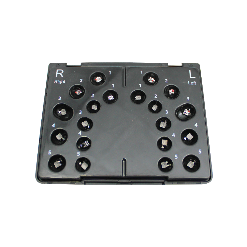Aditek Vector+ MBT metal brackets kit with hooks for orthodontic treatment, displayed on a white background.