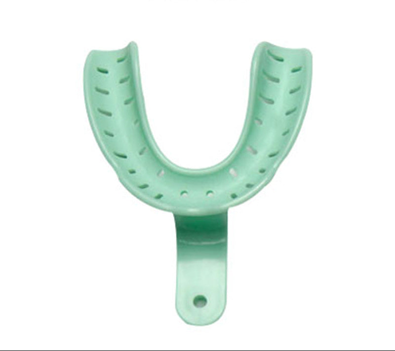 A set of large lower dentate impression trays from Astek Innovations for heat-mouldable dental impressions.