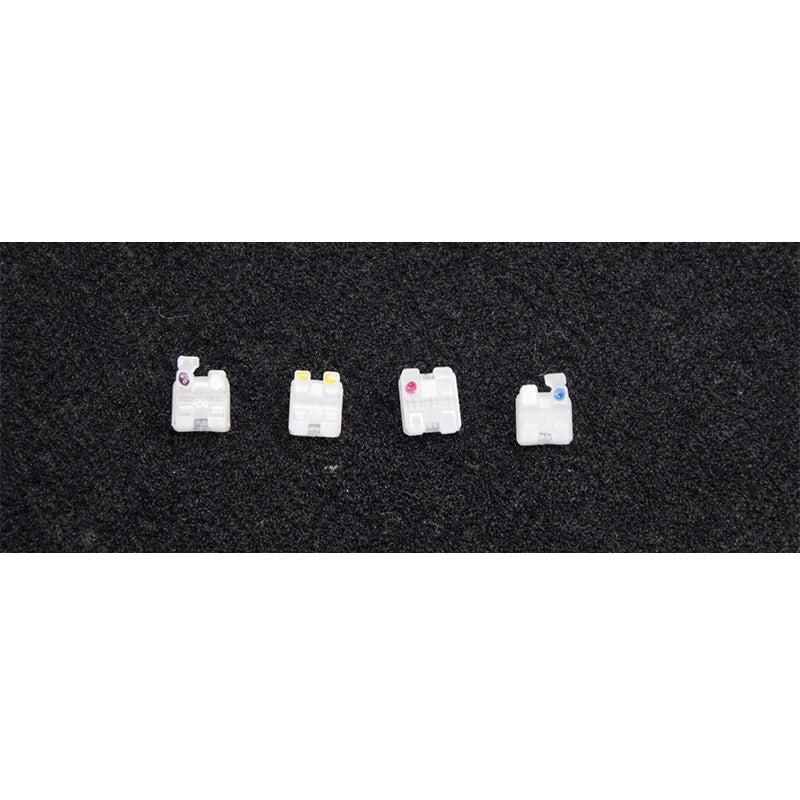 Axim ceramic aesthetic brackets for orthodontic treatment, Roth & MBT style, shown in a 20-piece kit with individual brackets and clear design.