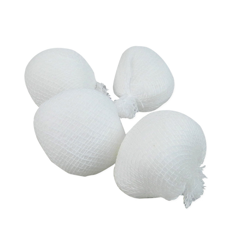 Capri cotton balls in a white cotton dispenser, showing soft, round cotton balls ready for skincare or cosmetic use.