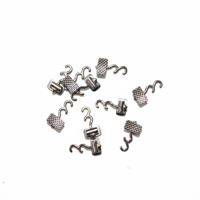 Captain Orthodontics Bondable Accessories, double crimpable hooks with left and right options, used for orthodontic bonding.