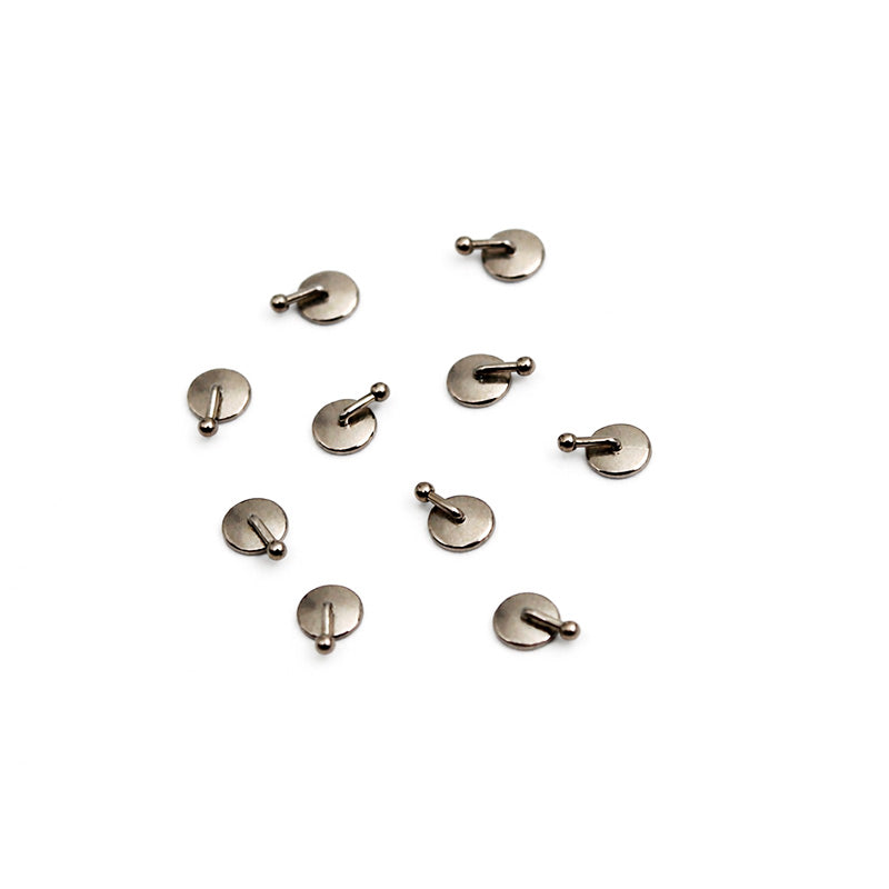 Captain Orthodontics bondable button with torquing hook, orthodontic appliance component, shown on a white background.