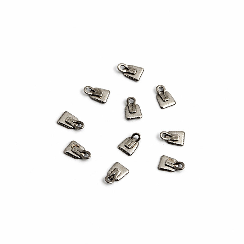 Captain Orthodontics bondable button with traction hook for orthodontic treatment, shown on a white background.