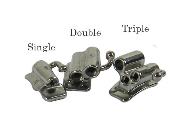 Five Captain Orthodontics MBT/Roth .022 bondable tubes on a molar bracket for orthodontic treatment.