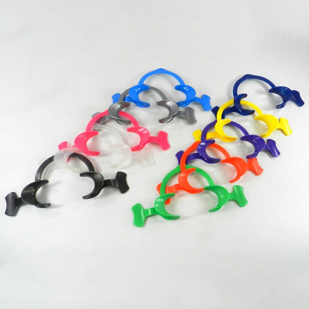 Captain Orthodontics Captain Flexi Eco cheek and tongue retractor with wings, showing flexible plastic design and winged features.