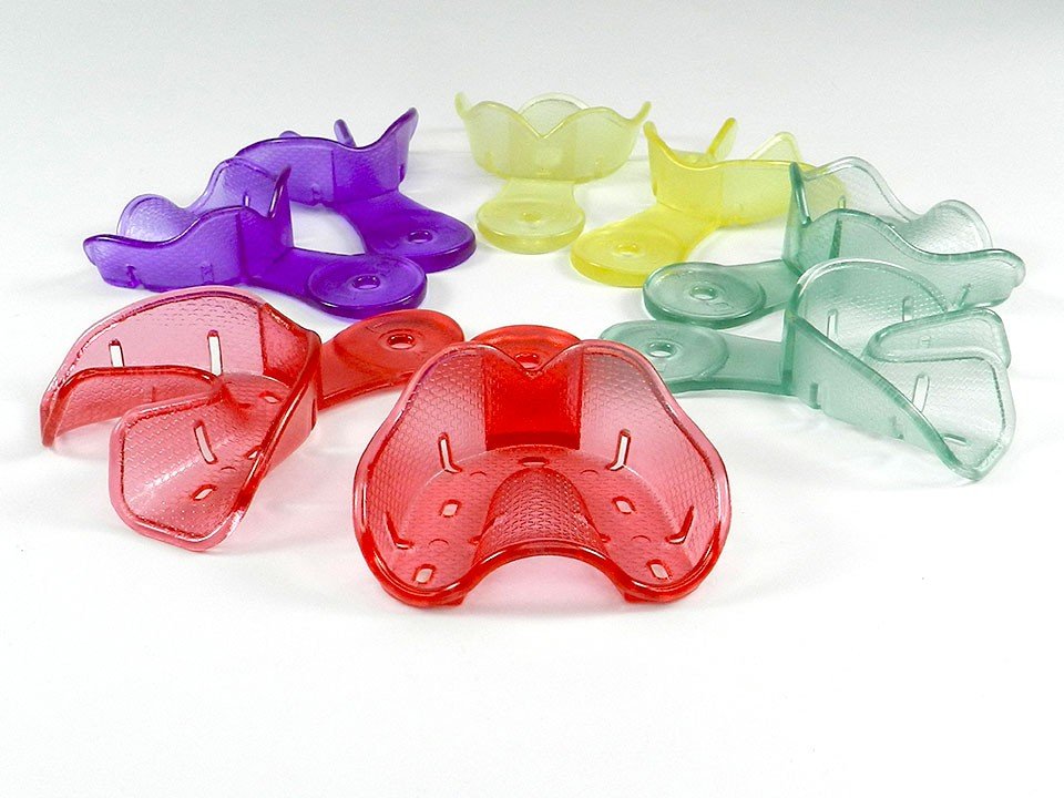 Set of four Captain Orthodontics Captain Ortho Premium orthodontic autoclavable impression trays for dental impressions.