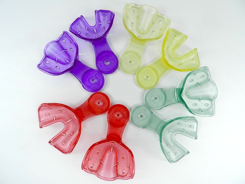 Set of four Captain Orthodontics Captain Ortho Premium orthodontic autoclavable impression trays for dental impressions.