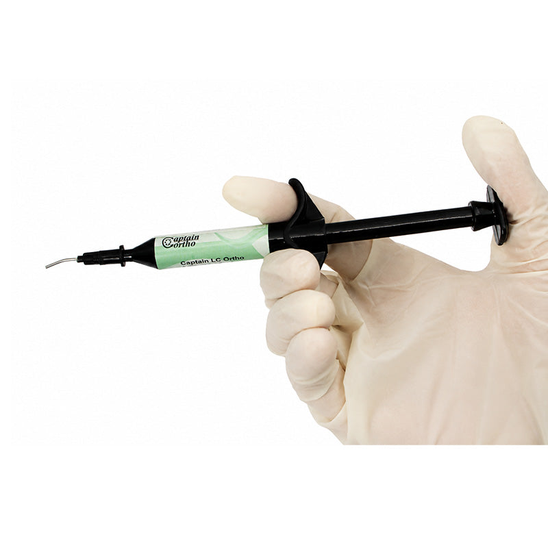 Captain Orthodontics Captain Light Cure Bonding Adhesive syringe kit for orthodontic bonding and dental repairs.