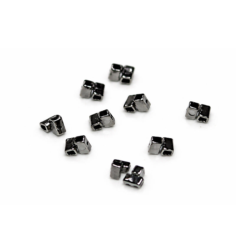 Captain Orthodontics Cross Tube with .022" slot and 2.0 mm length, used in orthodontic braces for secure wire retention.