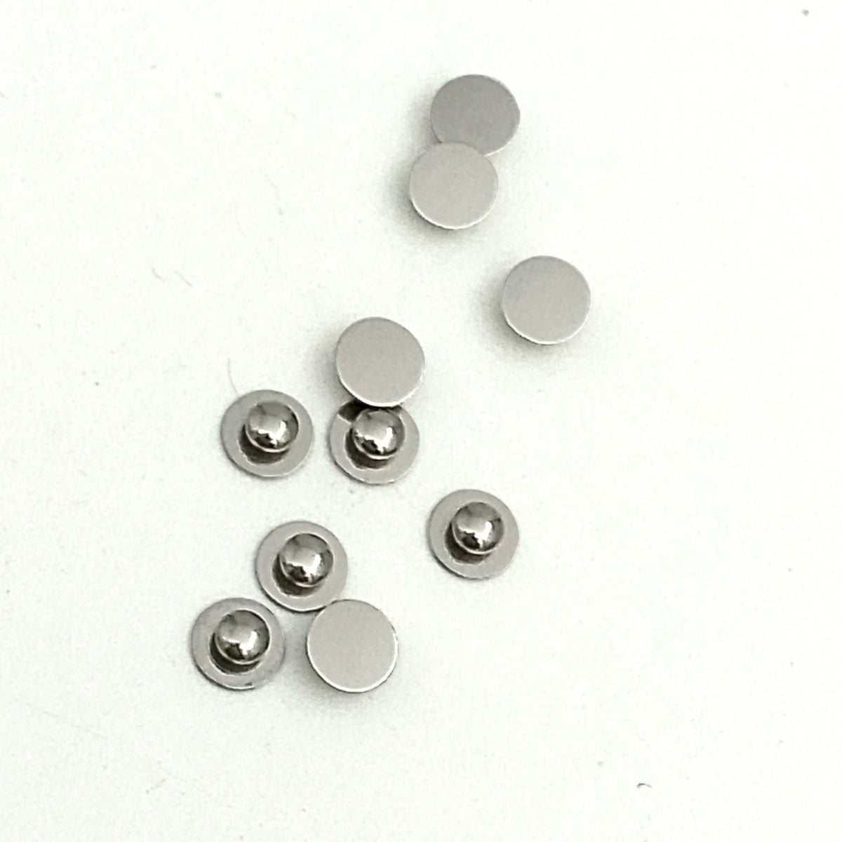 Captain Orthodontics Lingual Weldable Buttons Flat for braces, shown on a white background, designed for orthodontic bonding.