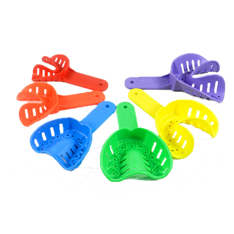 Pair of Centrino orthodontic autoclavable impression trays used for dental impressions in orthodontic procedures.