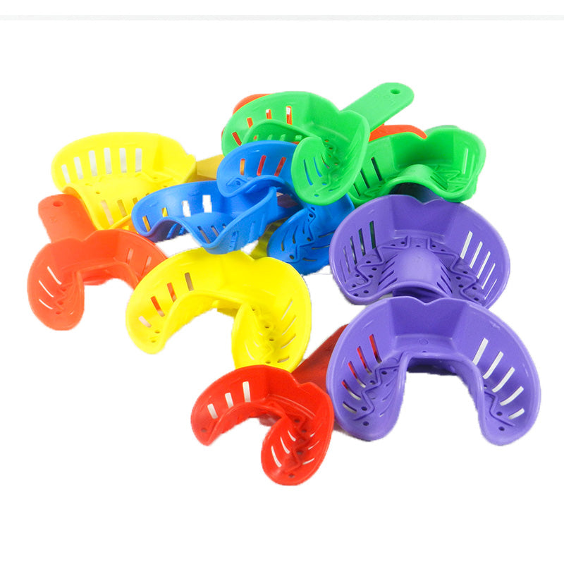 Pair of Centrino orthodontic autoclavable impression trays for dental impressions, made of durable materials.
