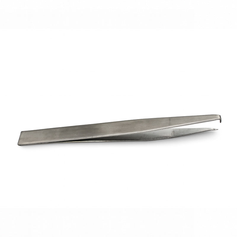 Centrino Self Ligating Bracket SLB instrument with metal bracket and ligating mechanism, used for orthodontic dental procedures.