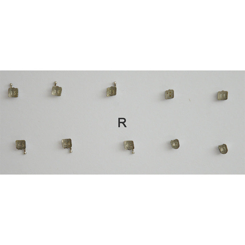 Set of 20 Dentaurum Discovery Smart Metal Brackets for orthodontic treatment, shown in close-up with detailed view of brackets.
