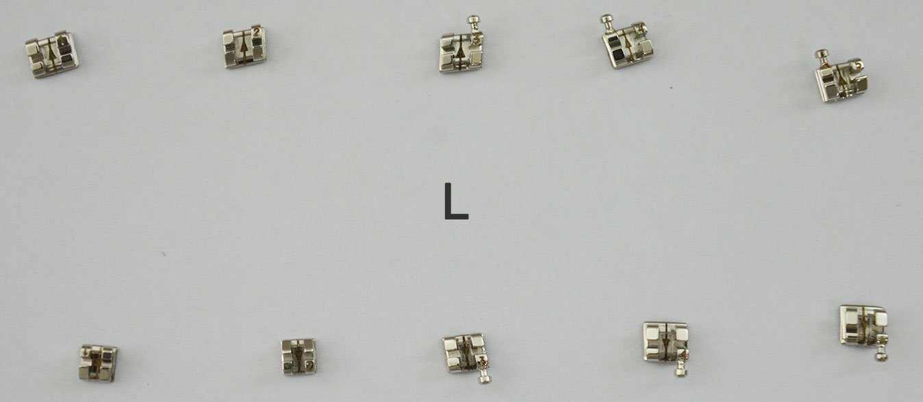 Dentaurum Orthodontics Equilibrium Brackets, Roth and MBT metal orthodontic brackets, standard and mini sizes, on a white background.