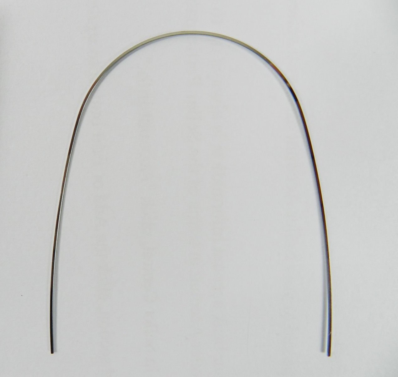 Stainless steel Dentaurum SS Trueform preformed archwire for orthodontic treatment, showing the 16 upper archwire with a smooth metallic finish.