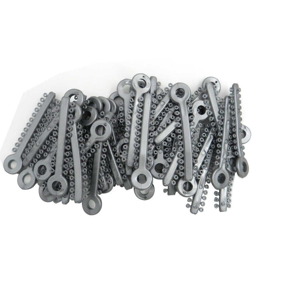 Silver Fox ligature ties used for woodwind instruments, shown in a close-up image with multiple ties arranged neatly.
