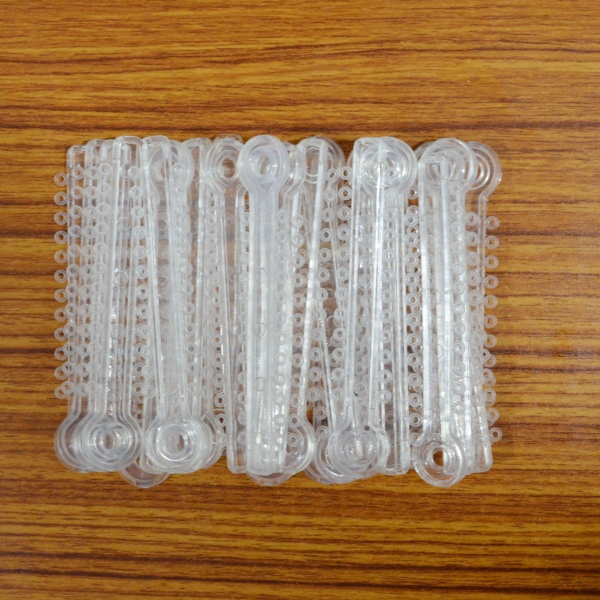 Silver Fox Ligature Ties for clarinet or saxophone, shown in a close-up image, designed to secure mouthpiece components.