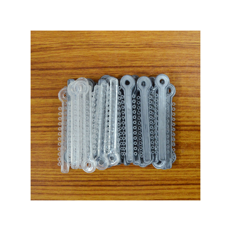 Silver Fox Ligature Ties for musical instruments, showing a close-up of the secure metal ties used for instrument maintenance.