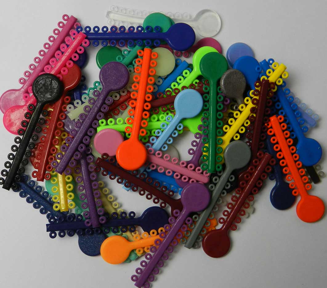 White G&H Select Elastomeric Ligature Ties for orthodontic use, shown in a 1000-pack, used for securing brackets and wires.
