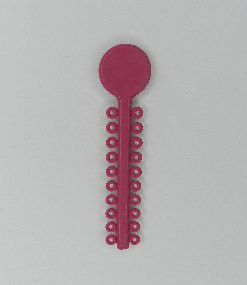 White G&H Select Elastomeric Ligature Ties for orthodontic use, shown in a close-up image.