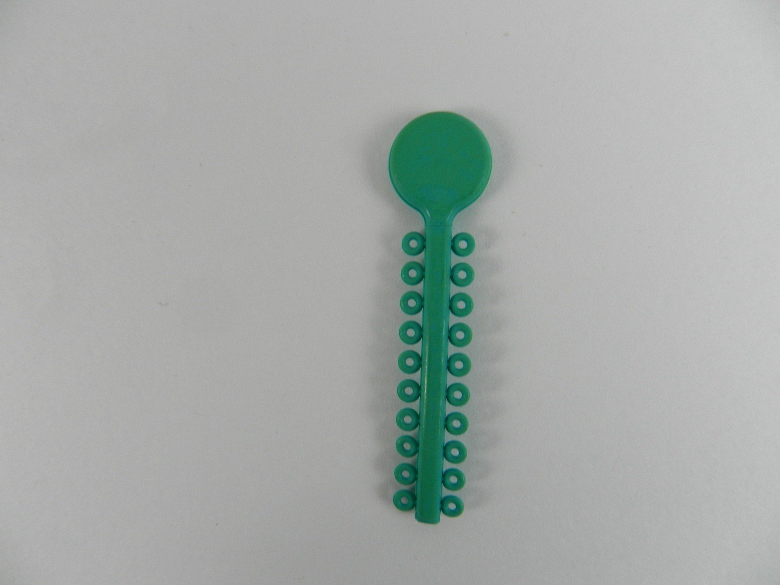 G&H Ortho G&H Select Elastomeric Ligature Ties in white, pack of 1000, used for orthodontic braces and dental applications.