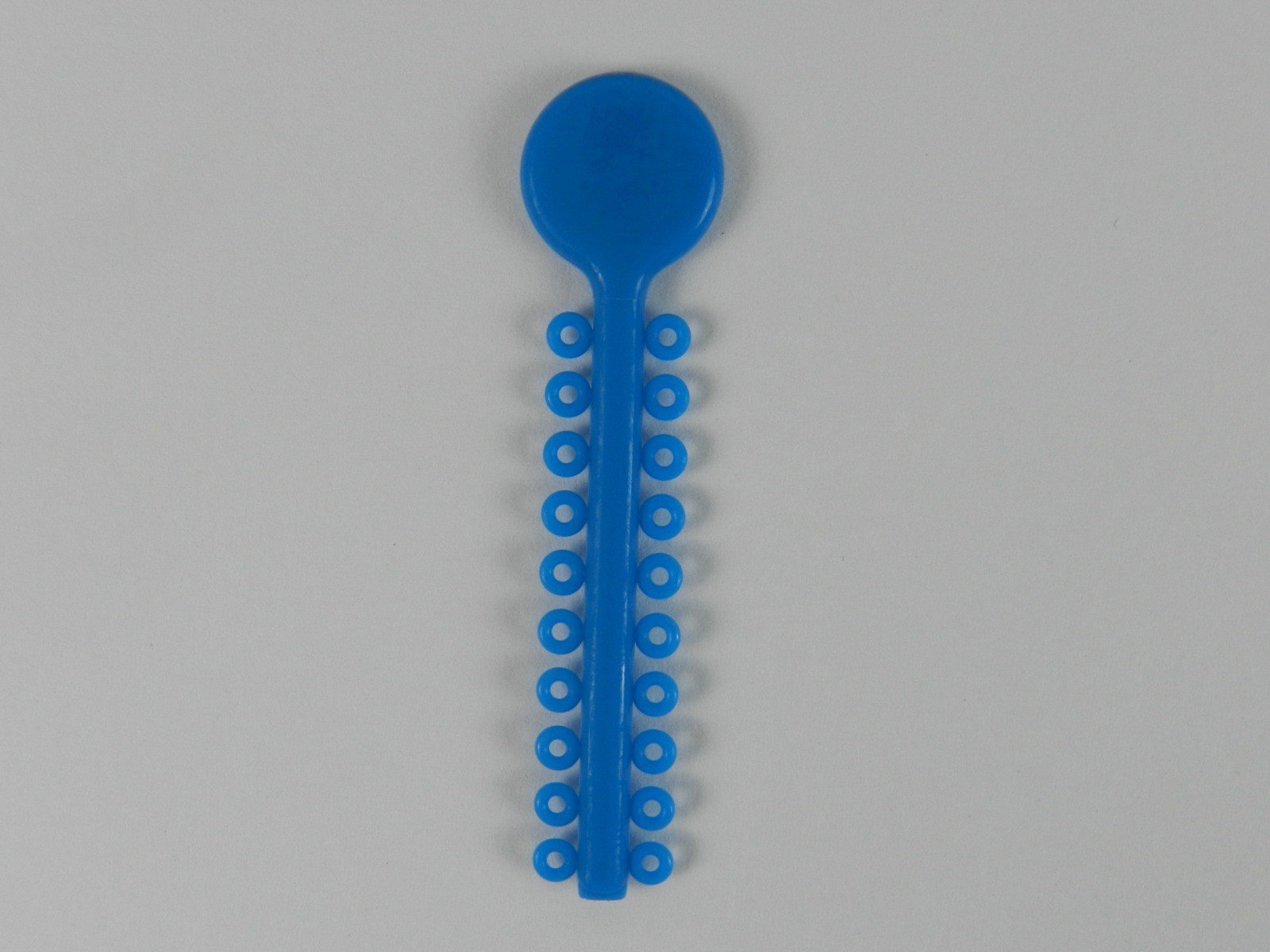 G&H Ortho G&H Select Elastomeric Ligature Ties in white, packaged in a large 1000-piece set, used for orthodontic braces.