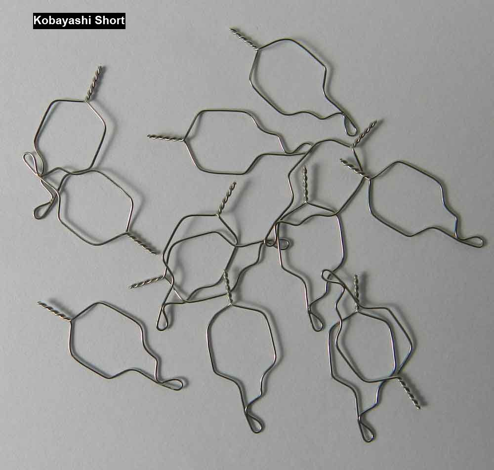 G&H Kobayashi Ties ligature wire and forms used in orthodontic treatments, shown in a close-up image.