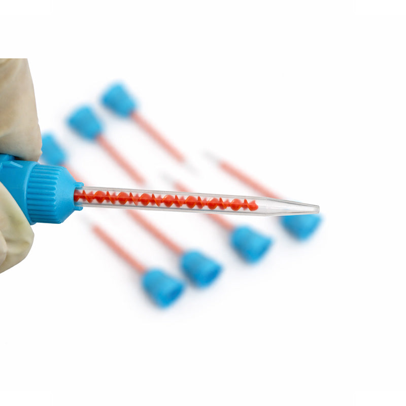 Blue and orange LD Dental Disposables mixing tips for dispensing guns, 50-piece pack, used for precise dental material application.