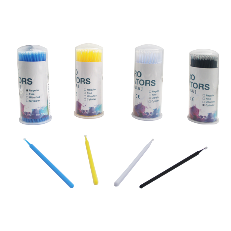 LD Disposable Micro Applicators used for precise dental applications, shown with ultrafine tips on dispensing guns and mixing tips.