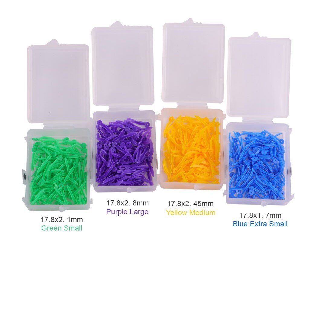 Blue LD Dental Fixing Wedges with Holes, extra small size, designed for dental procedures, made by LD Dental Disposables.