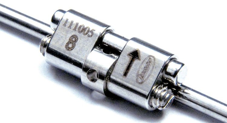 Leone S.p.a Rapid Micro Expander Screw for lower jaw, 11mm, used in orthodontic treatment, shown in close-up image.