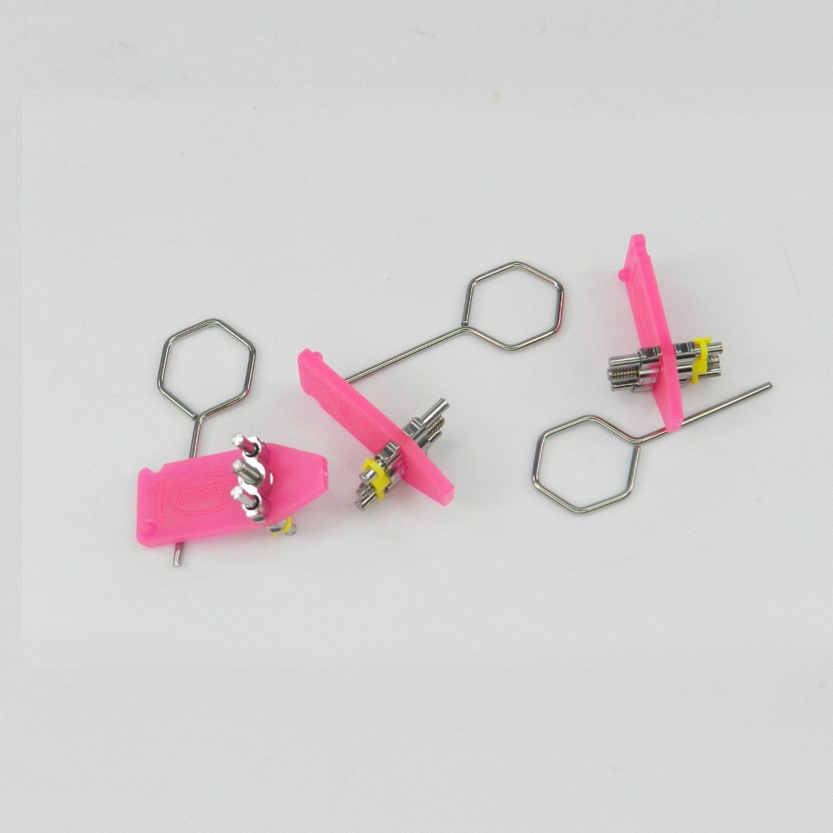 Leone s.p.a standard screw for upper pink shoe, 14 mm length, close-up view showing the screw head and threading detail.