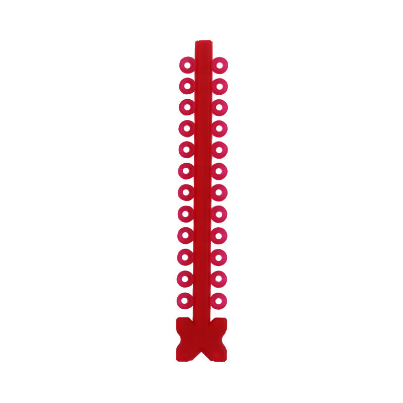 Assorted Morelli elastic ligature ties in modules, clear and colorful, used for securing orthodontic braces.