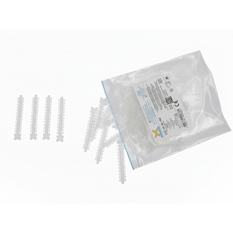 Morelli elastic ligature ties in assorted crystal colors, used for securing dental or medical modules.