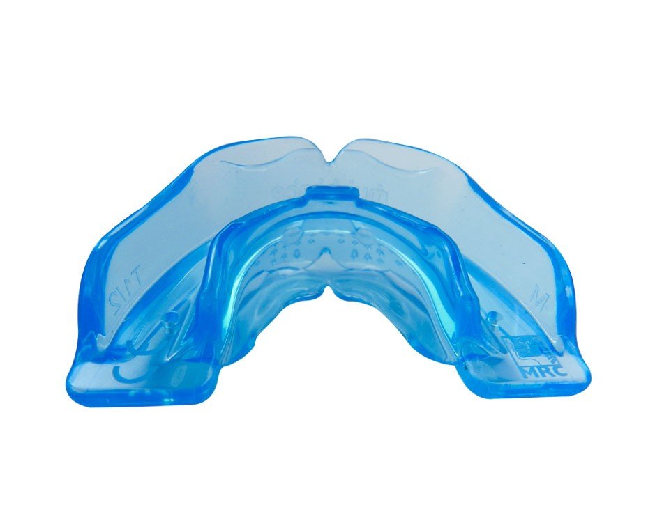 Blue MRC Myobrace trainer appliance for teens, stage 1, worn in the mouth with visible straps and adjustable components.