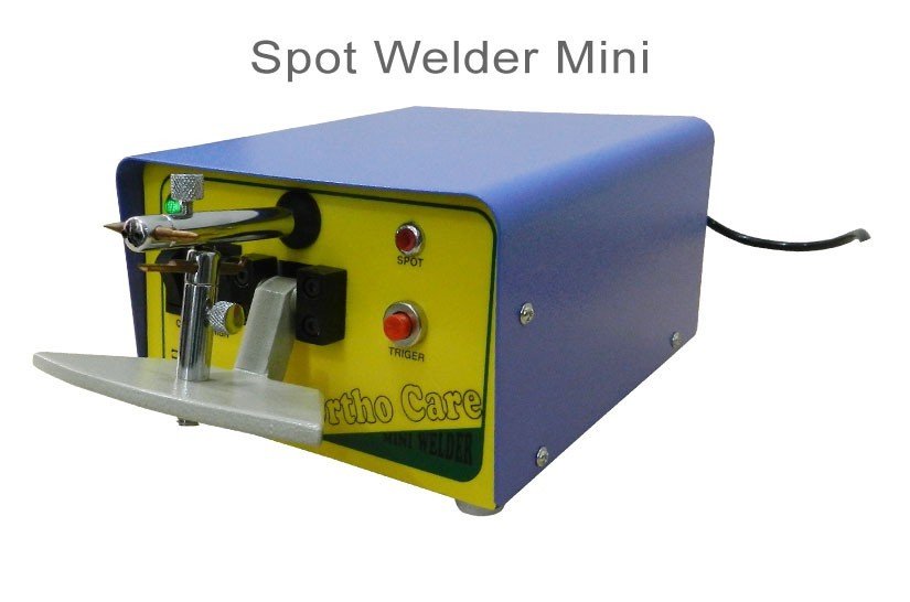 Mini OrthoCare Spot Welder used for precise dental or orthodontic repairs, showing the compact device with control buttons.