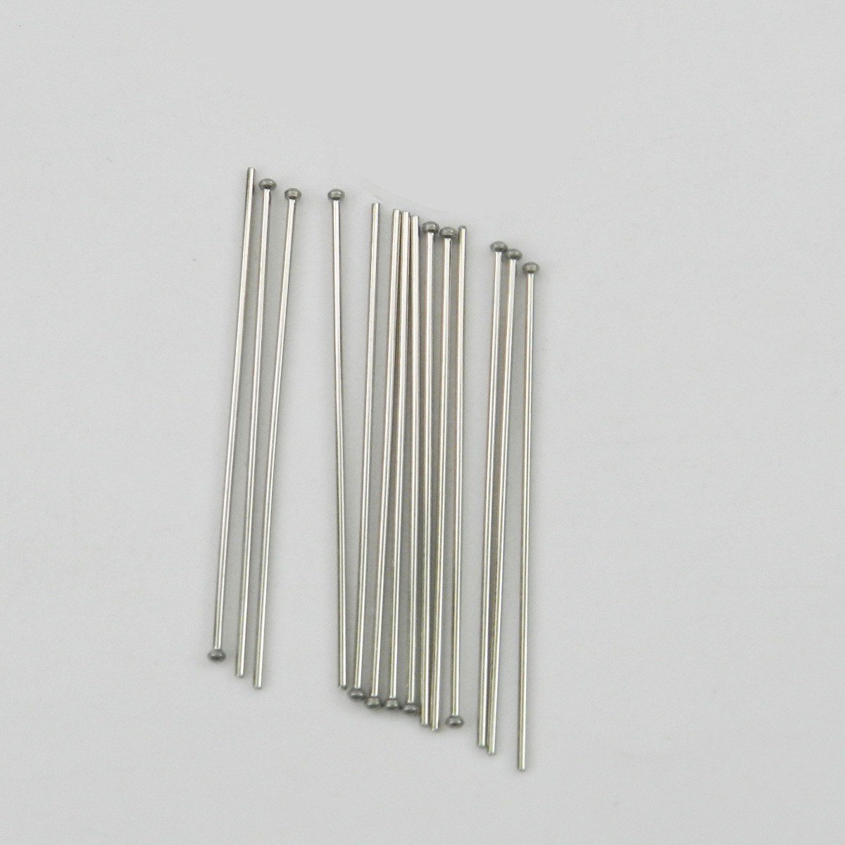 Rabbit Force ball end clasps, small metal fasteners with rounded ends, suitable for jewelry or craft projects.