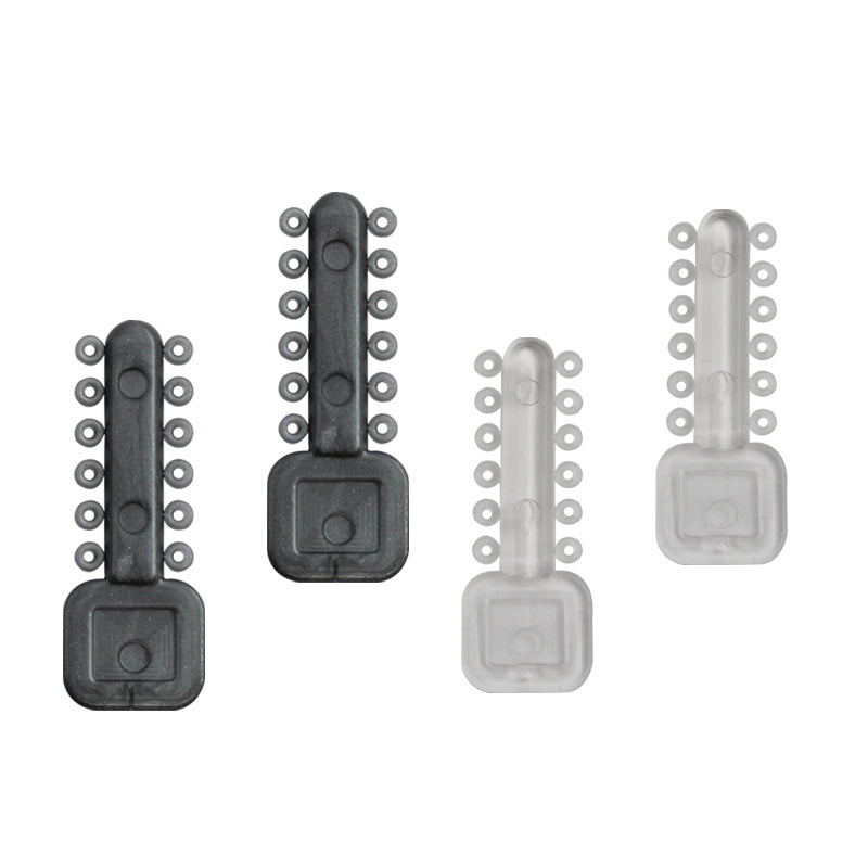 Clear Rabbit Force Mini Stix Ligature Ties for dental braces, shown in a close-up image of the small, transparent orthodontic ties.