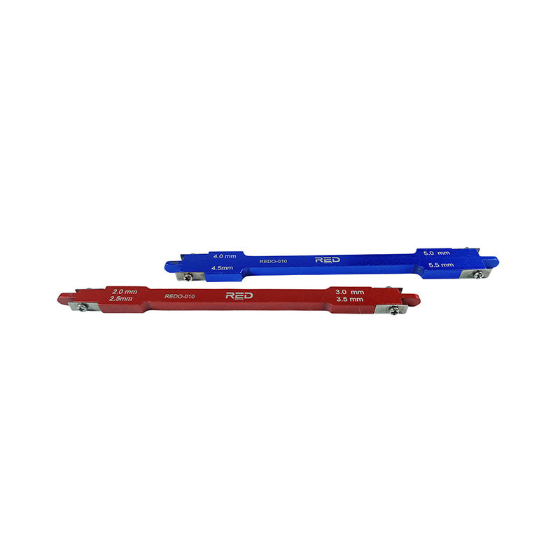 Red Ortho MBT Bracket Gauge 022 for precise bracket positioning, featuring a bright red plastic design with measurement markings.