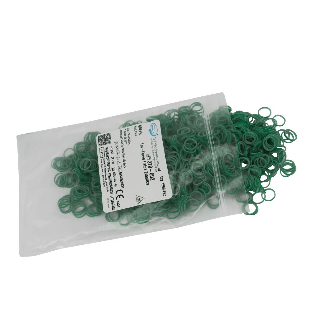 Red TP Orthodontics Col-R-Lastics elastics, orthodontic rubber bands used for braces, shown in a close-up image.