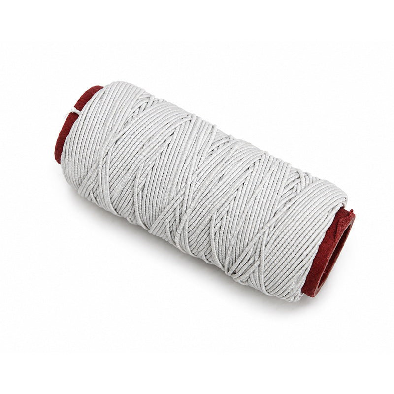 Light-colored TP Orthodontics elastic latex-free cotton sleeve and thread for orthodontic use, designed for comfort and durability.